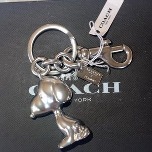 COACH X PEANUTS SNOOPY PEANUTS KEYCHAIN CHARM SILVER NWT!.